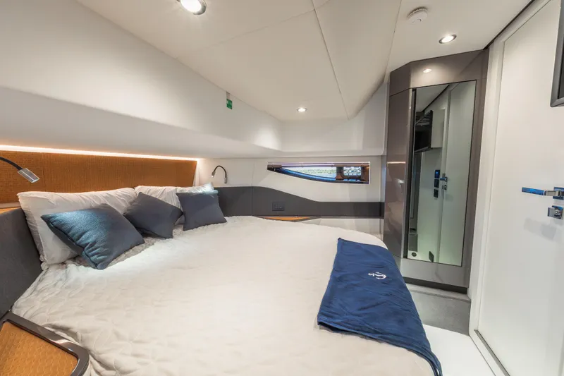 Slide: The Image of Luxurious cabin interior of 2023 Azimut Verve 47 yacht with modern design and cozy bedding. - 31