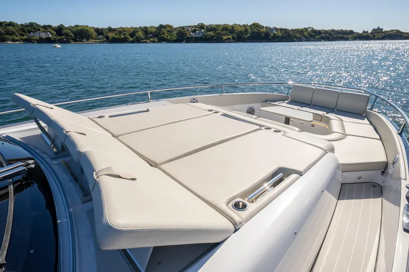 Slide: The Image of Luxurious 2023 Azimut Verve 47 yacht with spacious sunbathing deck on serene water. - 37