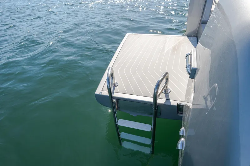 Slide: The Image of 2023 Azimut Verve 47 swim platform with ladder on calm water. - 7