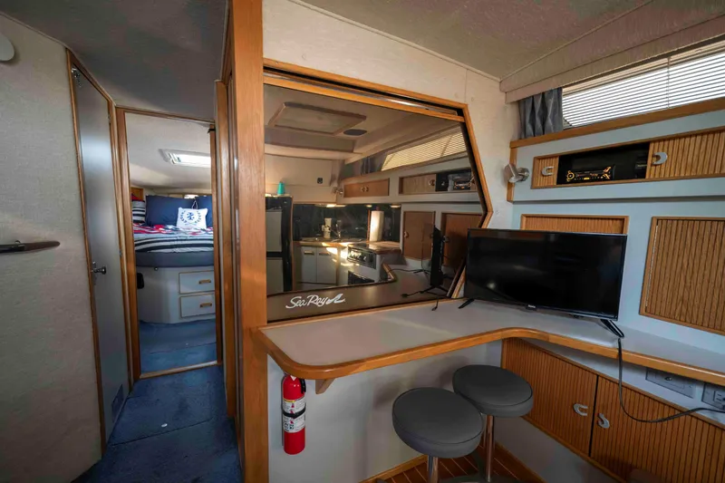 Slide: The Image of Interior of 1991 Sea Ray 390 Express Cruiser with cozy cabin and modern amenities. - 19