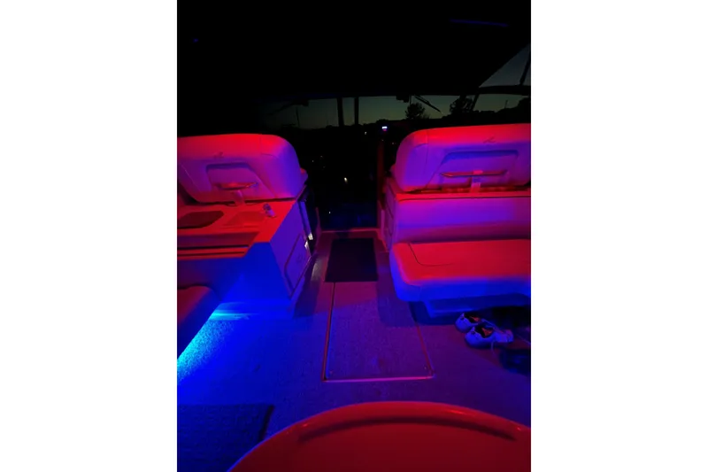 Slide: The Image of 1991 Sea Ray 390 Express Cruiser interior with vibrant red and blue lighting. - 33
