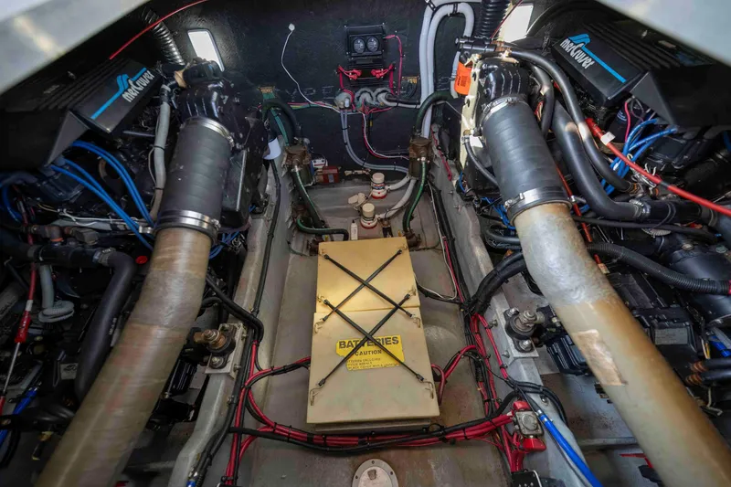 Slide: The Image of Engine compartment of a 1991 Sea Ray 390 Express Cruiser, showcasing mechanical components. - 37