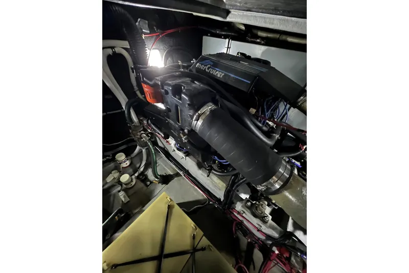 Slide: The Image of Engine compartment of a 1991 Sea Ray 390 Express Cruiser with MerCruiser components. - 38