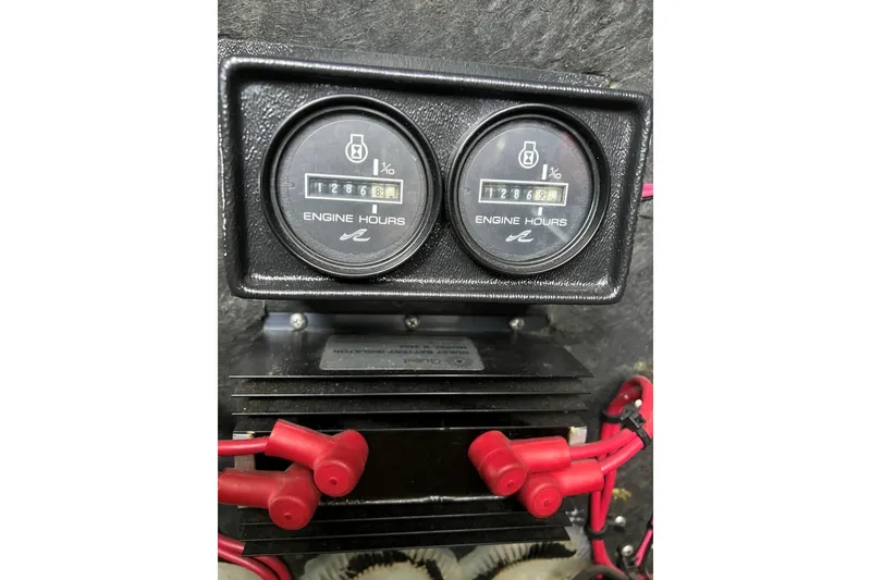 Slide: The Image of Engine hour meters on a 1991 Sea Ray 390 Express Cruiser, displaying usage hours. - 42