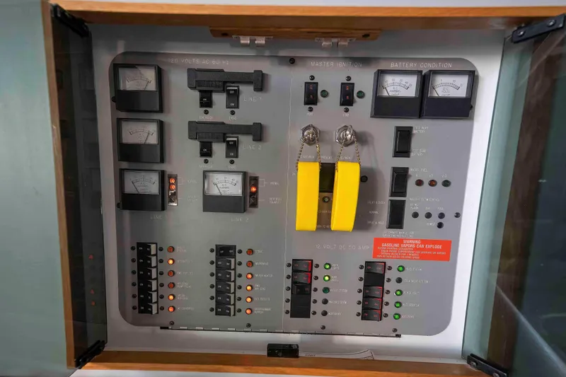 Slide: The Image of Electrical control panel of a 1991 Sea Ray 390 Express Cruiser boat. - 43