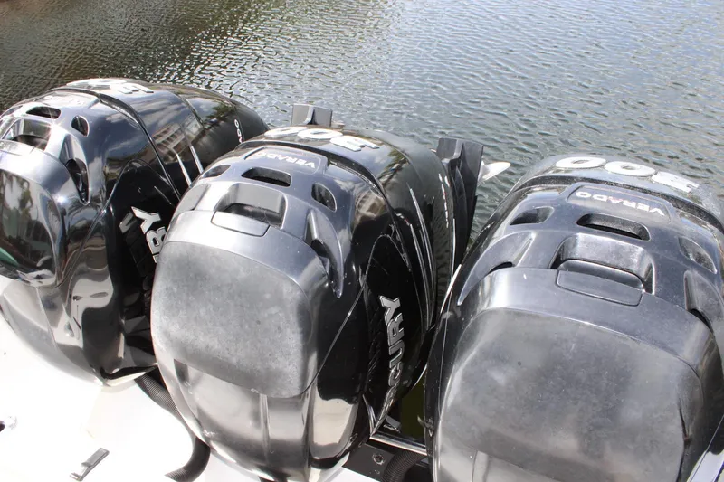 Slide: The Image of Triple Mercury outboard engines on a 2007 Fountain 34 Center Console boat. - 8