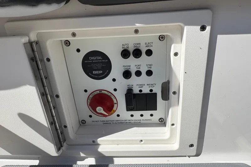 Slide: The Image of Control panel of a 2026 Chaparral SSX 4 boat with various switches and indicators. - 13