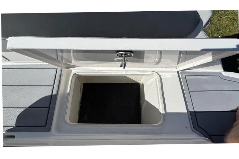 Slide: The Image of Open storage compartment on 2026 Chaparral SSX 4 boat deck. - 14
