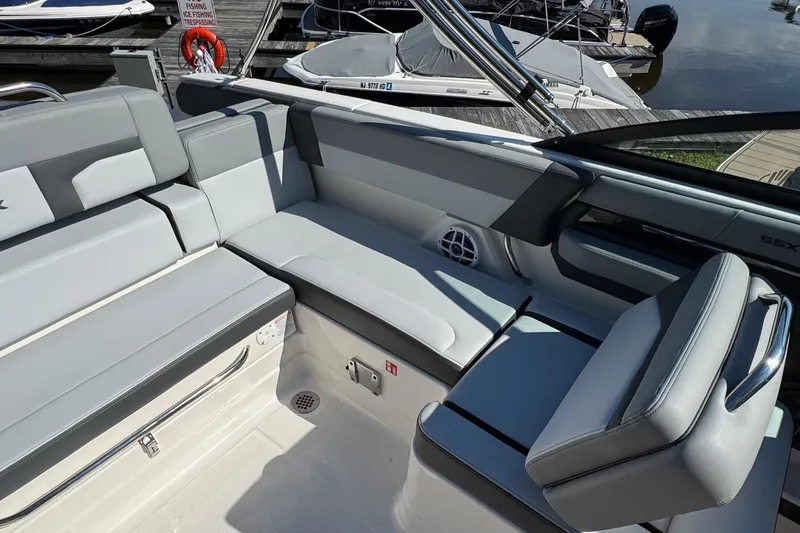 Slide: The Image of 2026 Chaparral SSX 4 boat interior with sleek gray seating and modern design. - 17