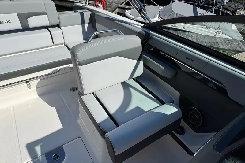 Slide: The Image of 2026 Chaparral SSX 4 boat interior with sleek gray seating and modern design. - 18