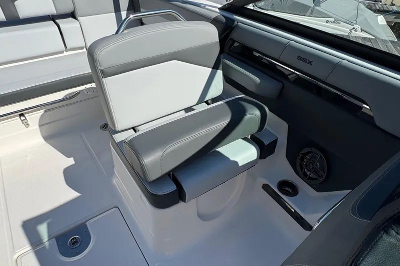 Slide: The Image of 2026 Chaparral SSX 4 boat interior with gray seating and modern design. - 19