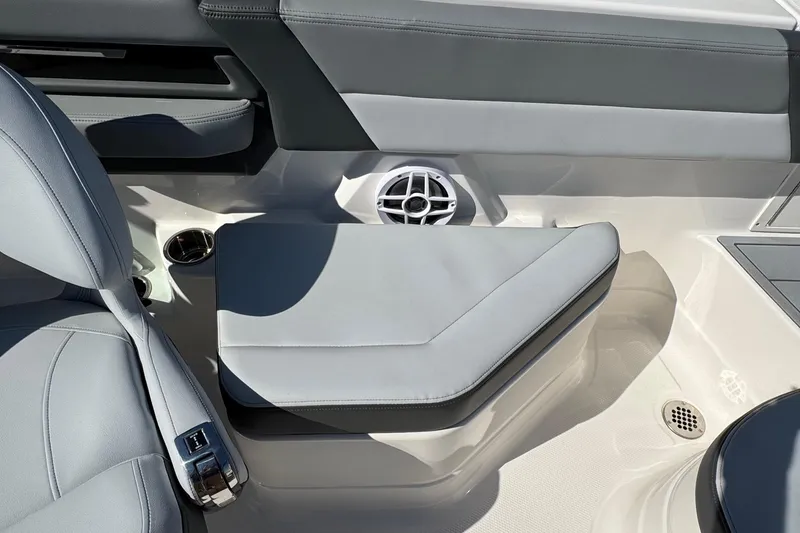 Slide: The Image of Interior seating of 2026 Chaparral SSX 4 boat with speaker and cup holder. - 20