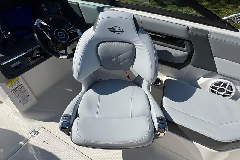 Slide: The Image of 2026 Chaparral SSX 4 boat interior with luxurious seating and modern steering wheel design. - 24