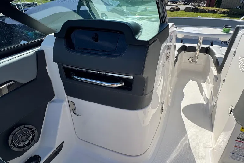 Slide: The Image of Interior view of 2026 Chaparral SSX 4 boat, featuring sleek design and modern amenities. - 26