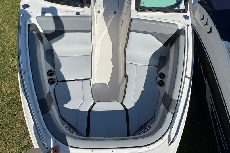 Slide: The Image of 2026 Chaparral SSX 4 boat interior with gray seating and cup holders. - 31