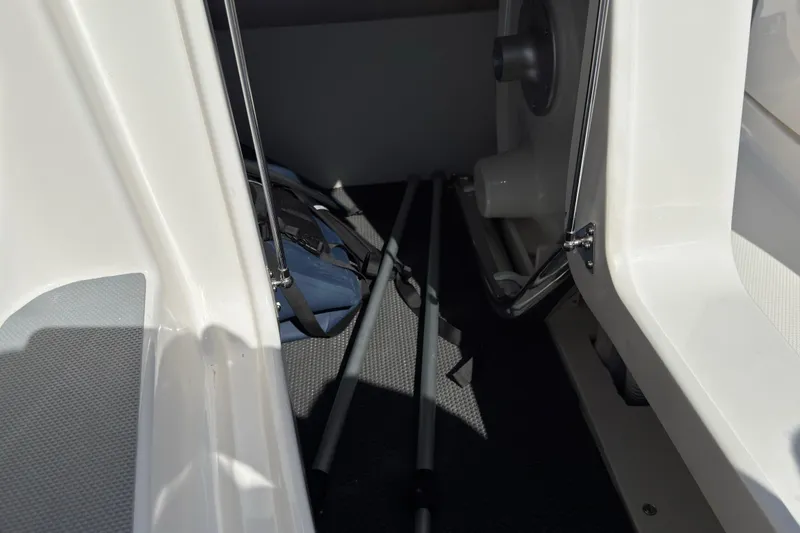 Slide: The Image of Interior view of 2026 Chaparral SSX 4 boat storage area with equipment. - 33