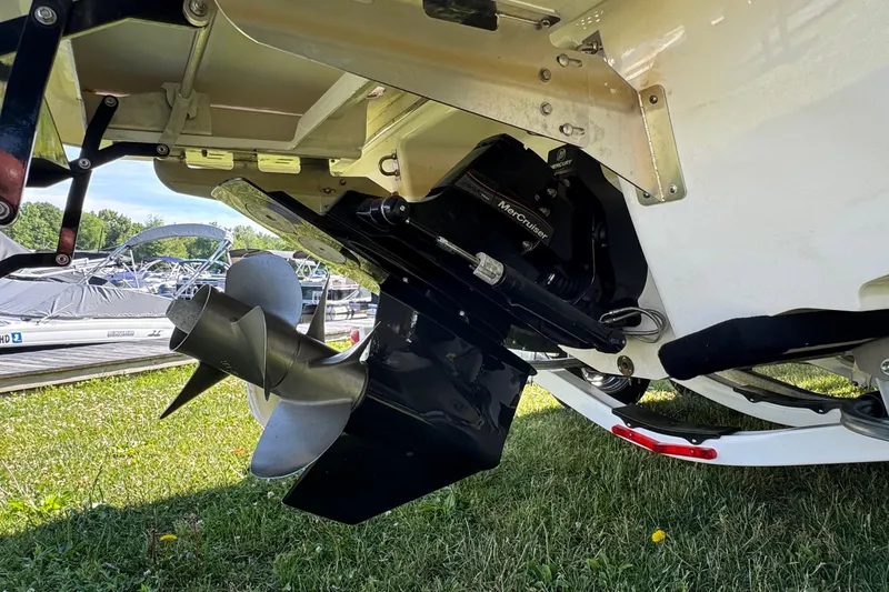 Slide: The Image of 2026 Chaparral SSX 4 boat with MerCruiser engine and propeller, displayed on grass. - 34