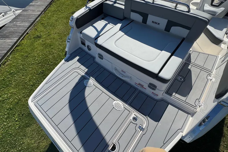 Slide: The Image of 2026 Chaparral SSX 4 boat deck with cushioned seating and sleek design. - 5