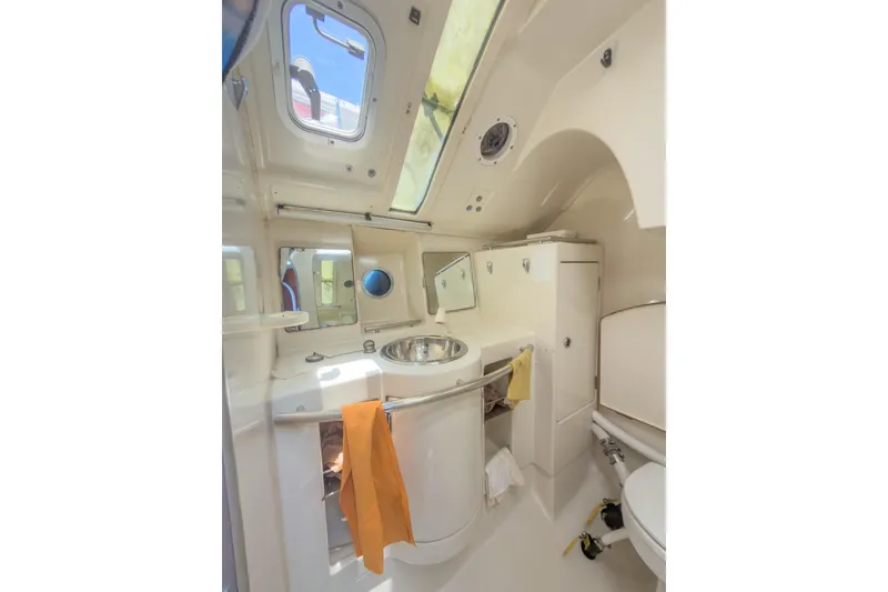 Slide: The Image of Interior of 1993 Beneteau First 38 s5 yacht bathroom with sink, mirror, and porthole. - 10