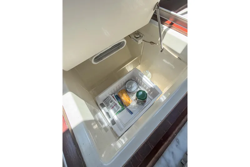 Slide: The Image of Storage compartment with food items on a 1993 Beneteau First 38 s5 yacht. - 15