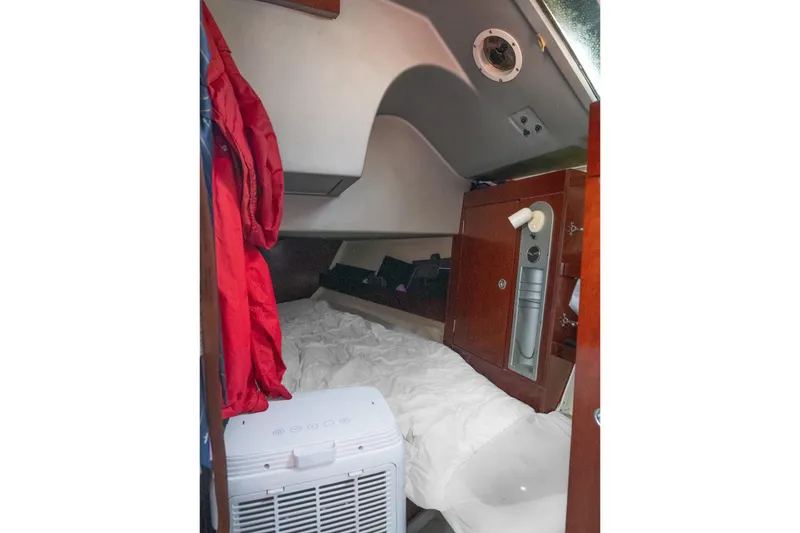 Slide: The Image of Cozy cabin interior of 1993 Beneteau First 38 s5 sailboat with bedding and storage. - 16