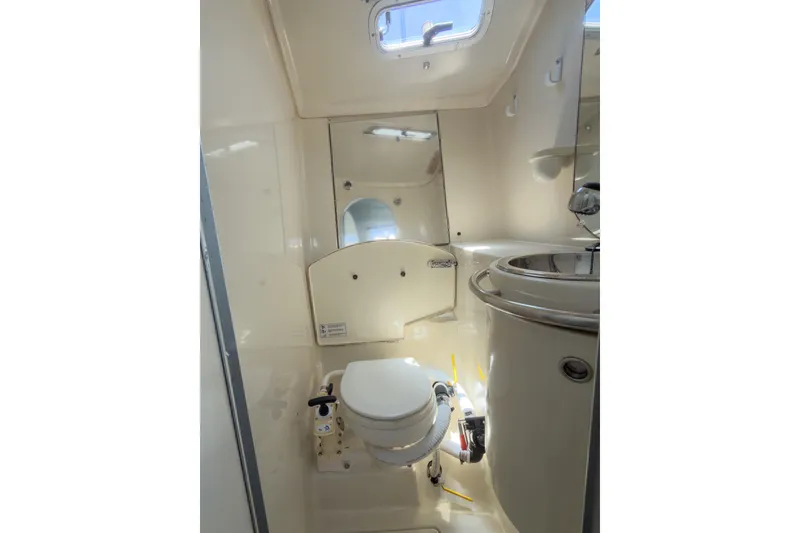 Slide: The Image of Bathroom interior of 1993 Beneteau First 38 s5 yacht, featuring toilet and sink. - 21