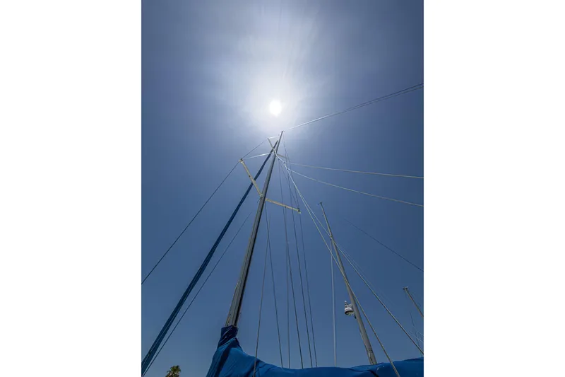 Slide: The Image of Sailboat mast of 1993 Beneteau First 38 s5 under bright sun and clear sky. - 25