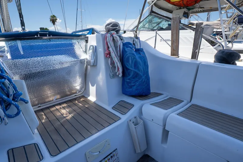 Slide: The Image of Cockpit of 1993 Beneteau First 38 s5 sailboat with ropes and seating. - 4
