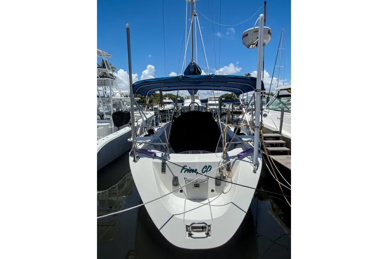 Slide: The Image of Beneteau First 38 s5 sailboat, 1993 model, docked at marina under clear blue sky. - 6