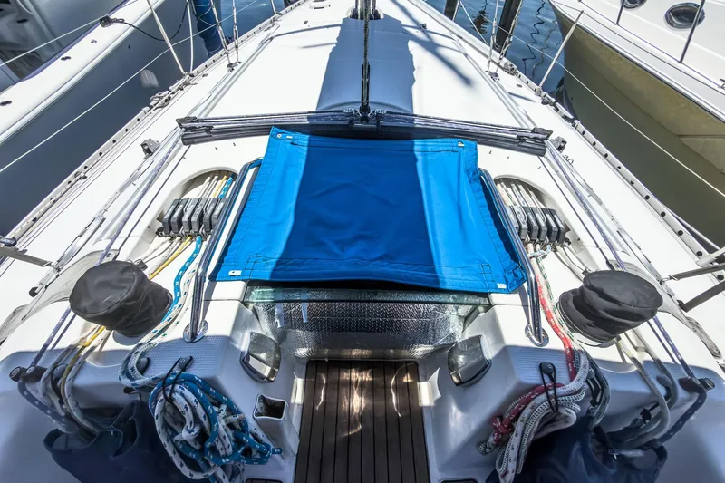 Slide: The Image of Deck view of a 1993 Beneteau First 38 s5 sailboat with blue canvas cover. - 7
