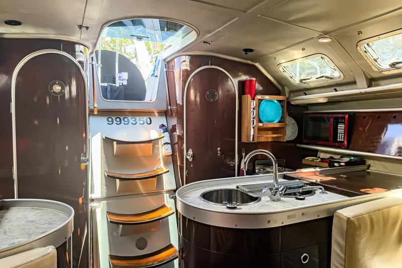 Slide: The Image of Interior of a 1993 Beneteau First 38 s5 sailboat with modern kitchen amenities. - 8