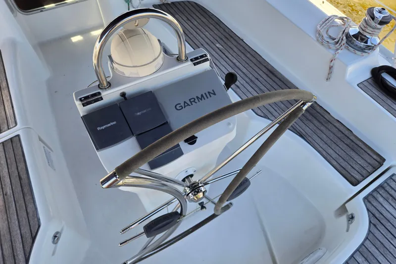 Slide: The Image of Steering wheel and navigation equipment on a 2003 Beneteau 393 sailboat. - 11