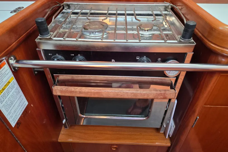Slide: The Image of Stainless steel stove and oven in 2003 Beneteau 393 yacht galley. - 24