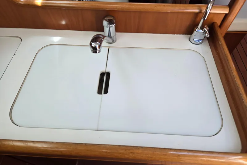 Slide: The Image of Galley sink with cover on a 2003 Beneteau 393 sailboat. - 26