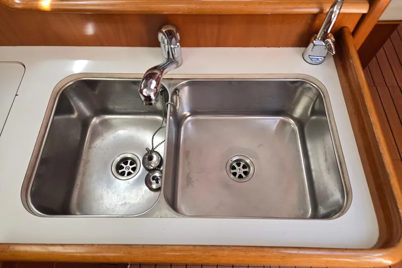 Slide: The Image of Stainless steel double sink in 2003 Beneteau 393 yacht kitchen. - 27