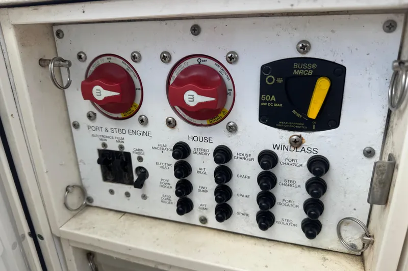 Slide: The Image of Control panel of a 2011 Pursuit C 280 Center Console boat with switches and dials. - 16