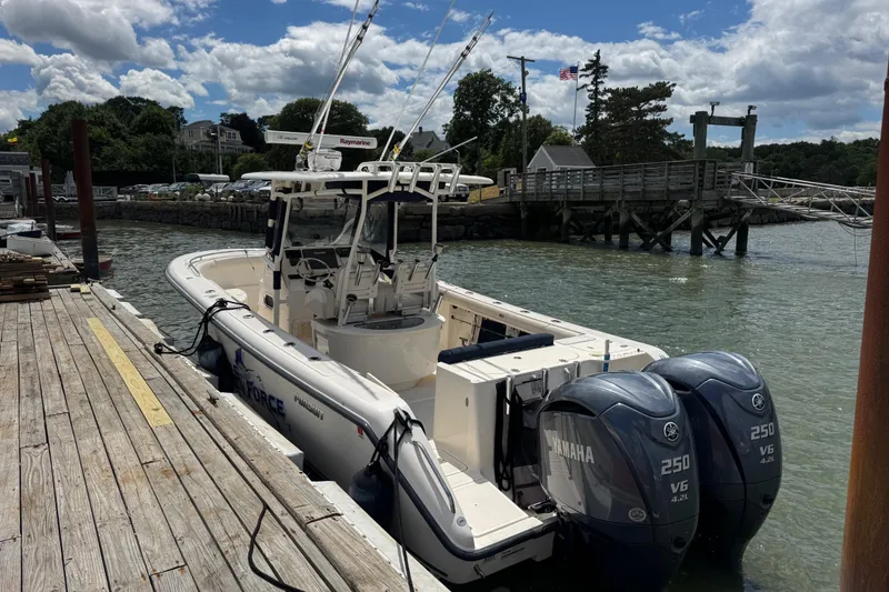 Slide: The Image of 2011 Pursuit C 280 Center Console boat docked with twin Yamaha engines. - 3