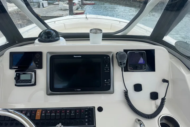 Slide: The Image of 2011 Pursuit C 280 Center Console dashboard with navigation and communication equipment. - 6