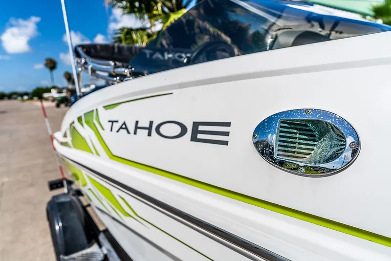 Slide: The Image of Close-up of a 2021 Tracker Tahoe boat with green accent. - 6