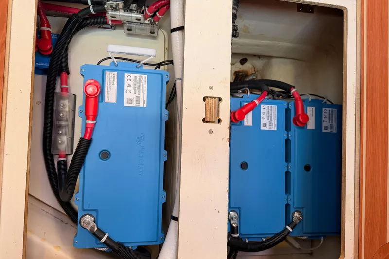 Slide: The Image of Electrical system of a 2008 Hunter 45 Deck Salon yacht, featuring blue battery units. - 105