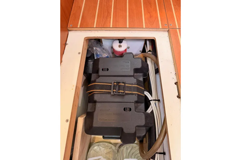 Slide: The Image of Interior view of 2008 Hunter 45 Deck Salon, showcasing storage compartment and equipment. - 108