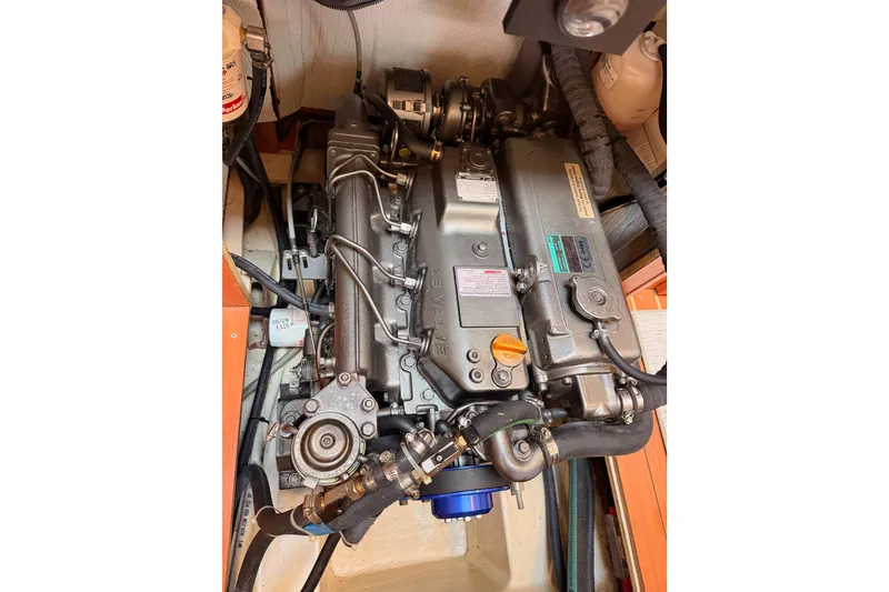 Slide: The Image of Engine compartment of a 2008 Hunter 45 Deck Salon sailboat, showcasing detailed components. - 109