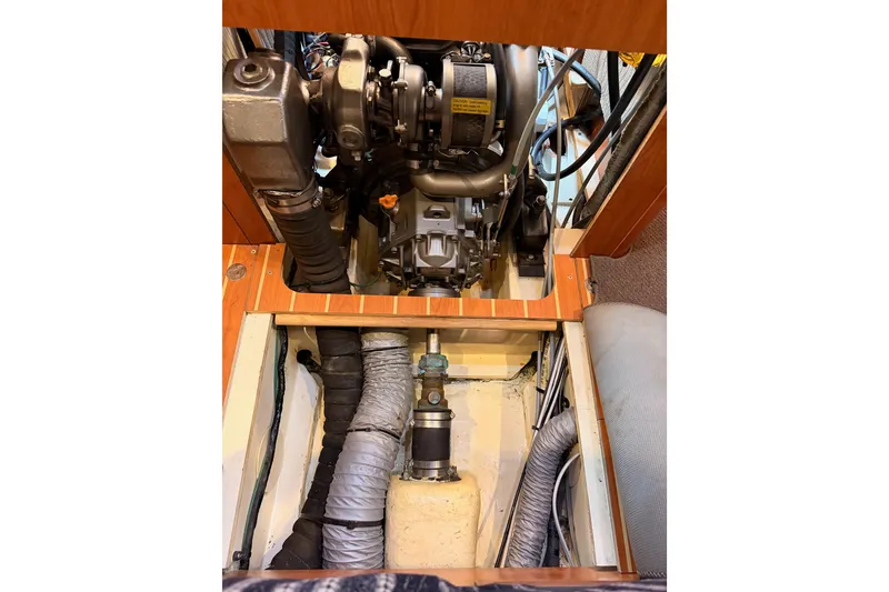 Slide: The Image of Engine compartment of 2008 Hunter 45 Deck Salon sailboat, showcasing mechanical components. - 112