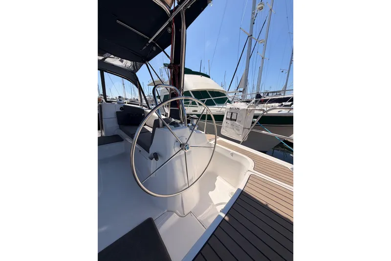Slide: The Image of 2008 Hunter 45 Deck Salon yacht cockpit with steering wheel, docked at marina. - 16