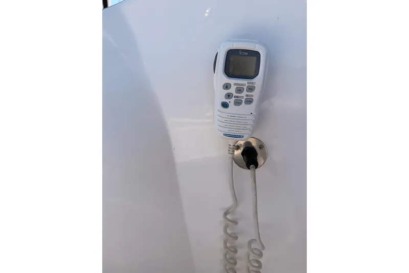 Slide: The Image of VHF radio handset on 2008 Hunter 45 Deck Salon yacht, mounted on white panel. - 20