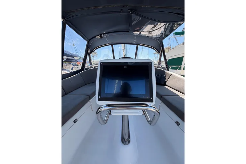 Slide: The Image of 2008 Hunter 45 Deck Salon sailboat docked in marina, showcasing sleek design and windows. - 29