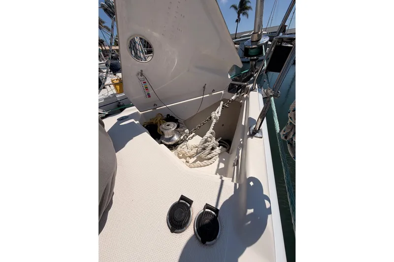 Slide: The Image of 2008 Hunter 45 Deck Salon yacht deck with anchor chain and ropes. - 31