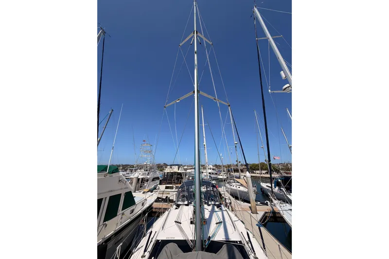Slide: The Image of Sailboats docked at a marina, featuring a 2008 Hunter 45 Deck Salon. - 34