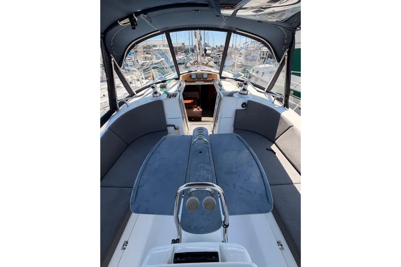 Slide: The Image of Interior view of a 2008 Hunter 45 Deck Salon sailboat, featuring spacious seating and helm. - 42