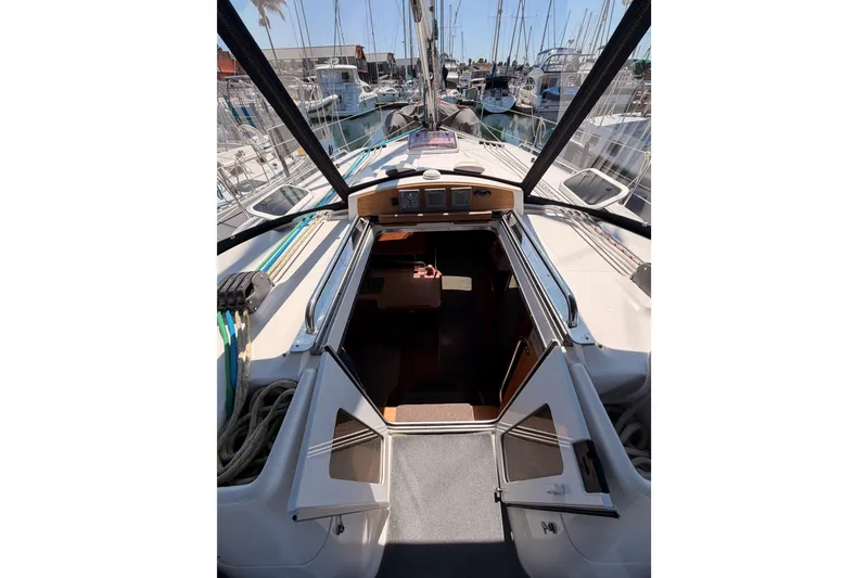 Slide: The Image of 2008 Hunter 45 Deck Salon yacht interior view at marina. - 46